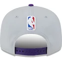 new-era-flat-brim-9fifty-tip-off-2023-los-angeles-lakers-nba-grey-and-purple-snapback-cap